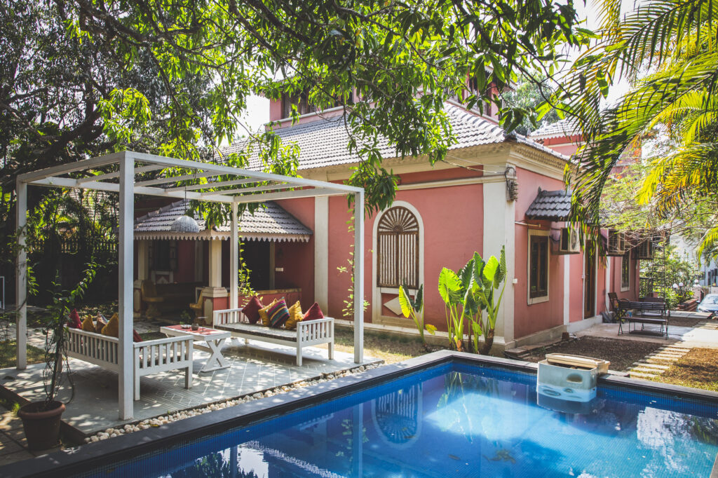 Old Portuguese villa outdoors with a patio and swimming pool