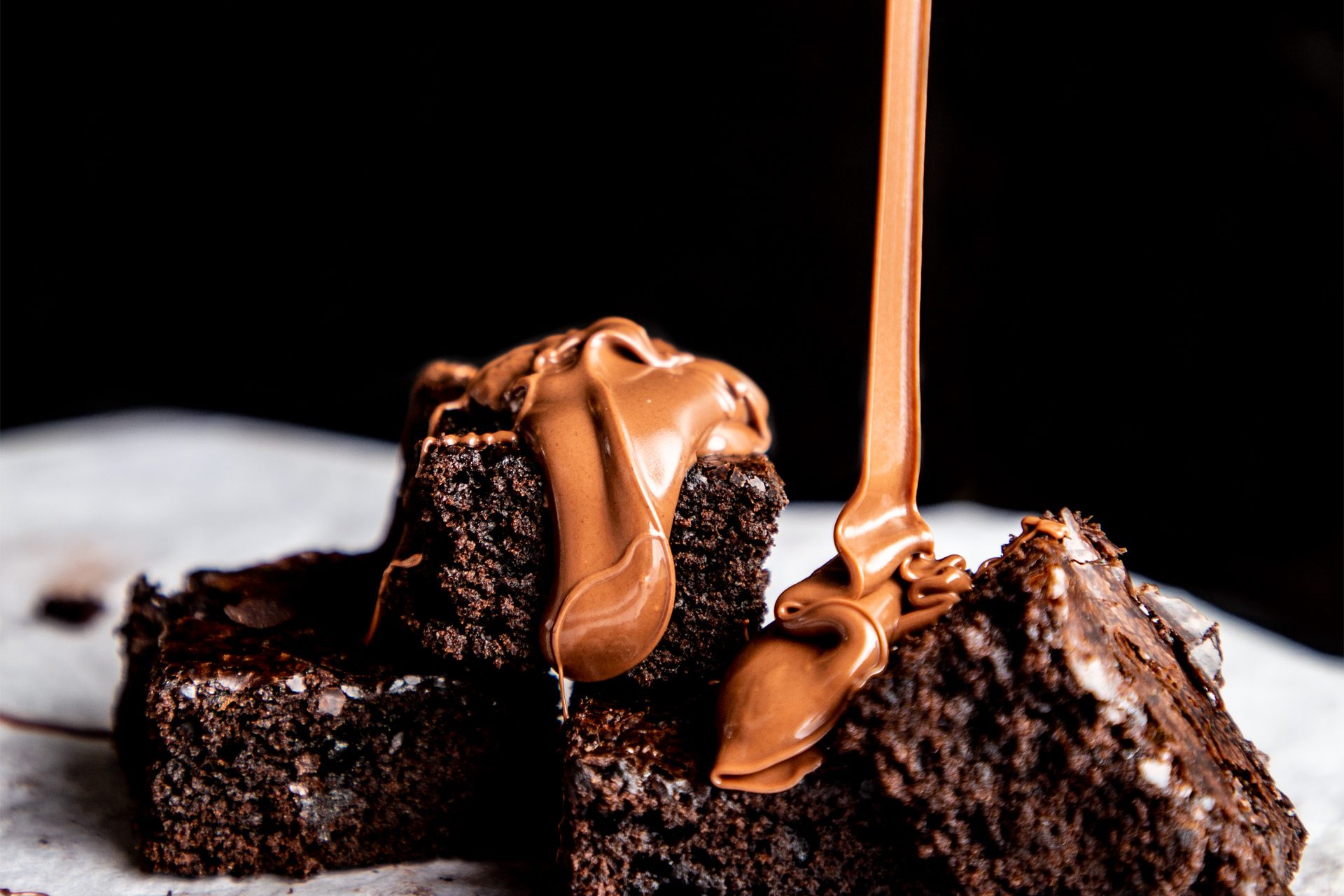 Brownies with chocolate sauce dripping